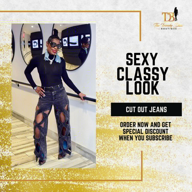 A woman in a black top and ripped jeans