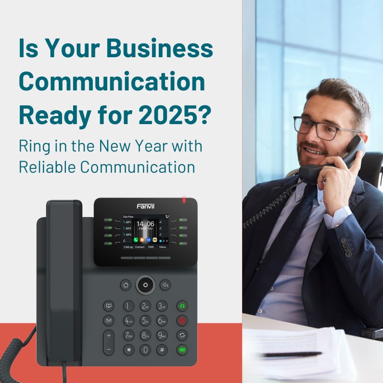 A man sitting at a desk talking on a phone