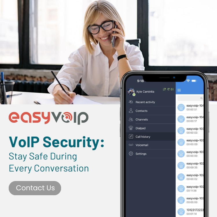 A woman sitting at a desk talking on a cell phone