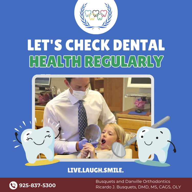 A man and a little girl brushing their teeth