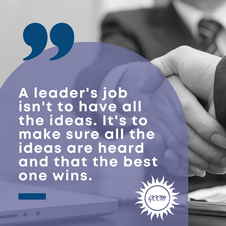 Two people shaking hands over a laptop computer