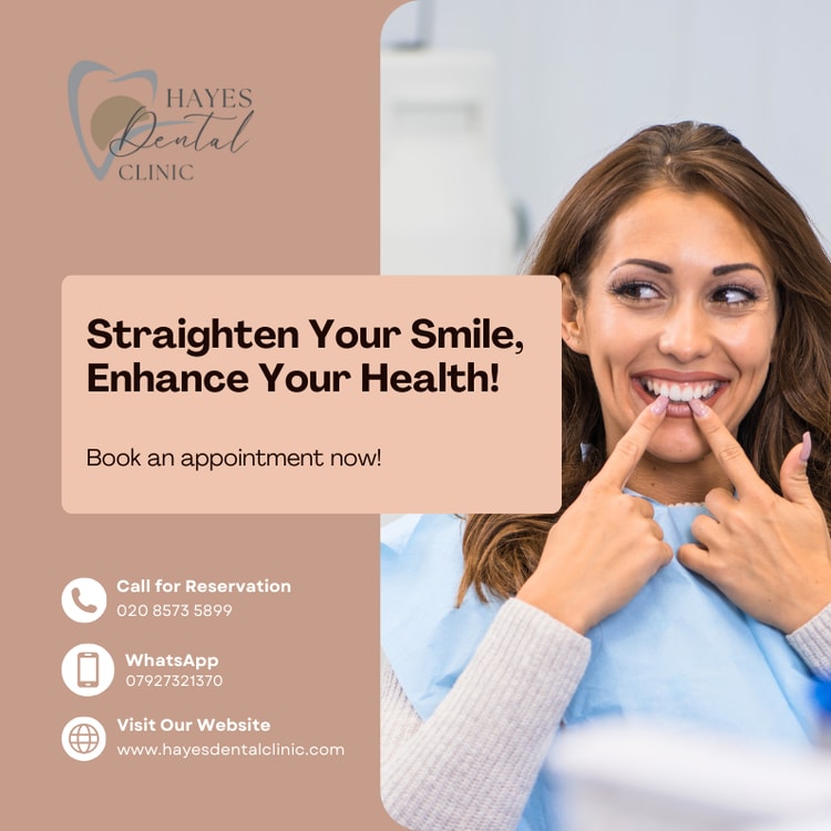 A woman smiling while holding her teeth in front of her