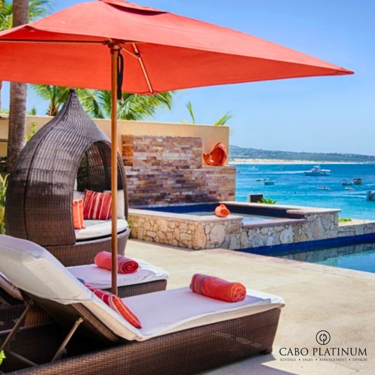 Sunbed with pool and beach view