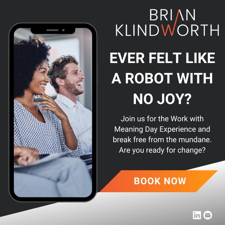 A man and a woman sitting next to each other on a cell phone