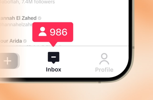 A cell phone with a message bubble on the screen