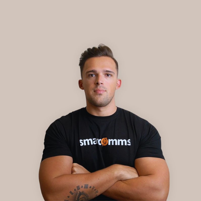 A man in a black shirt with his arms crossed