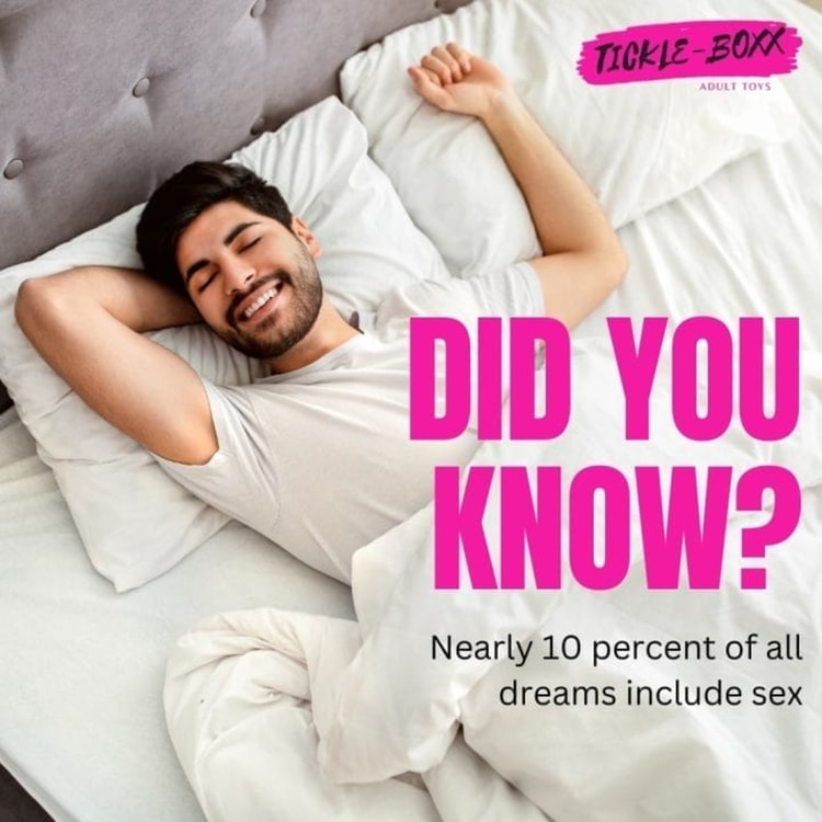 A man laying on top of a bed under a pink sign