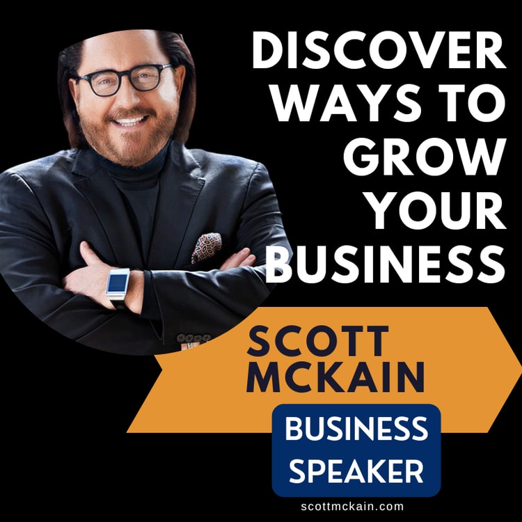 A man in a suit and glasses with his arms crossed