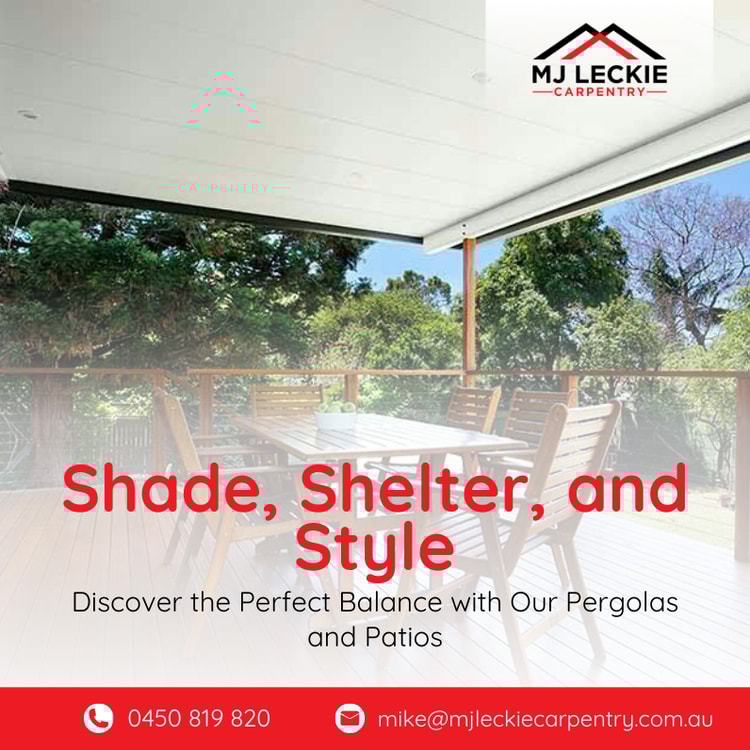 A patio with a table and chairs on it