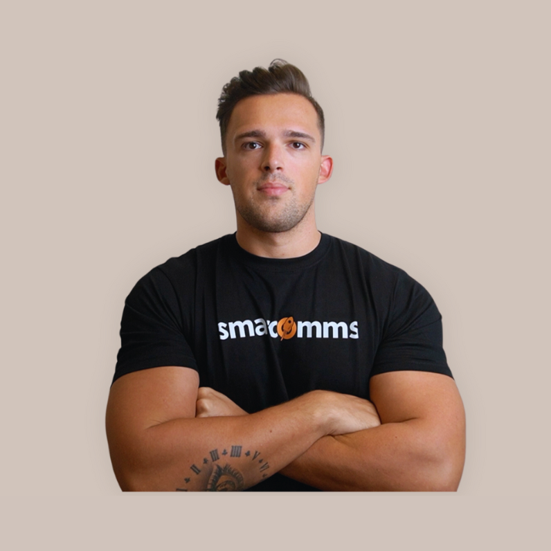 A man in a black shirt with his arms crossed