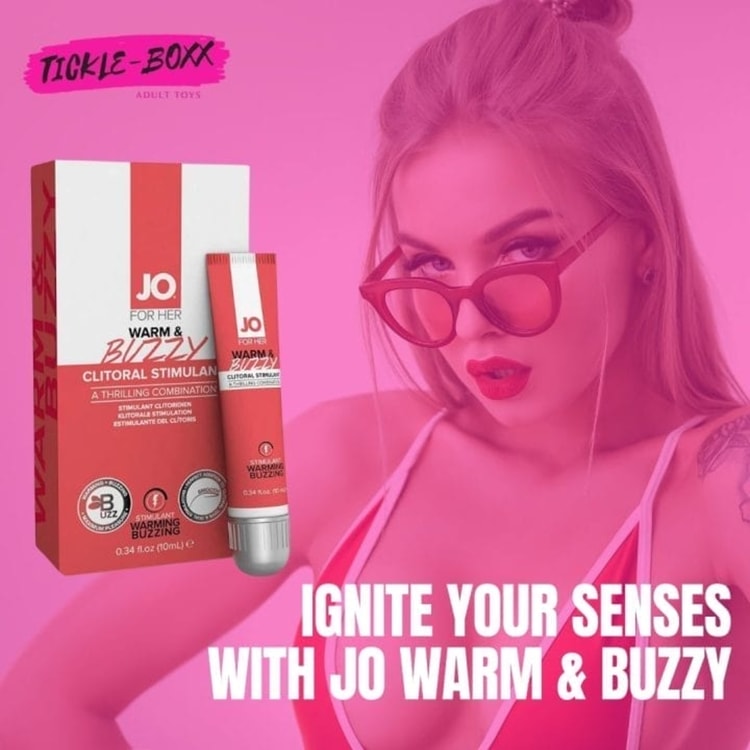 A woman in a bikini with a tube of sunscreen