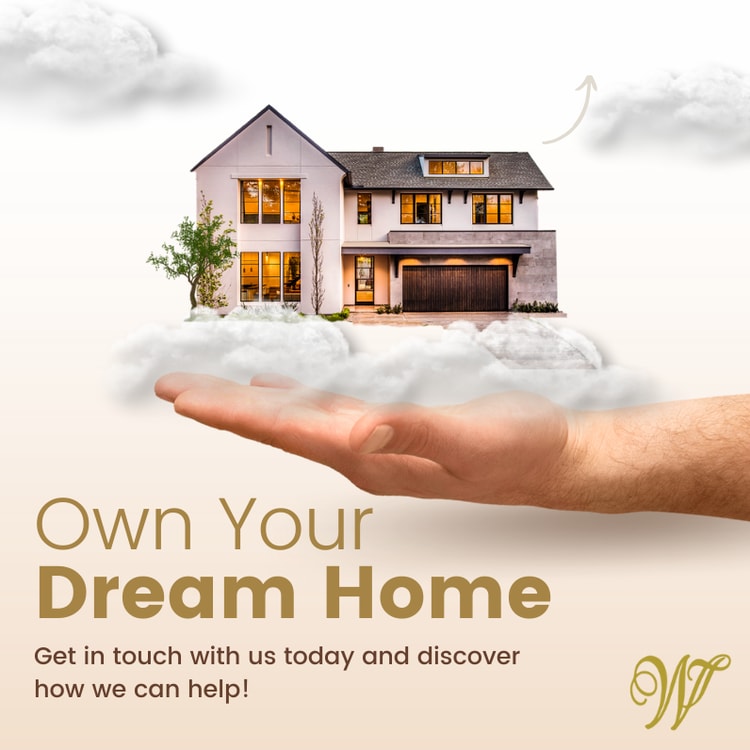 A hand holding a house with clouds in front of it