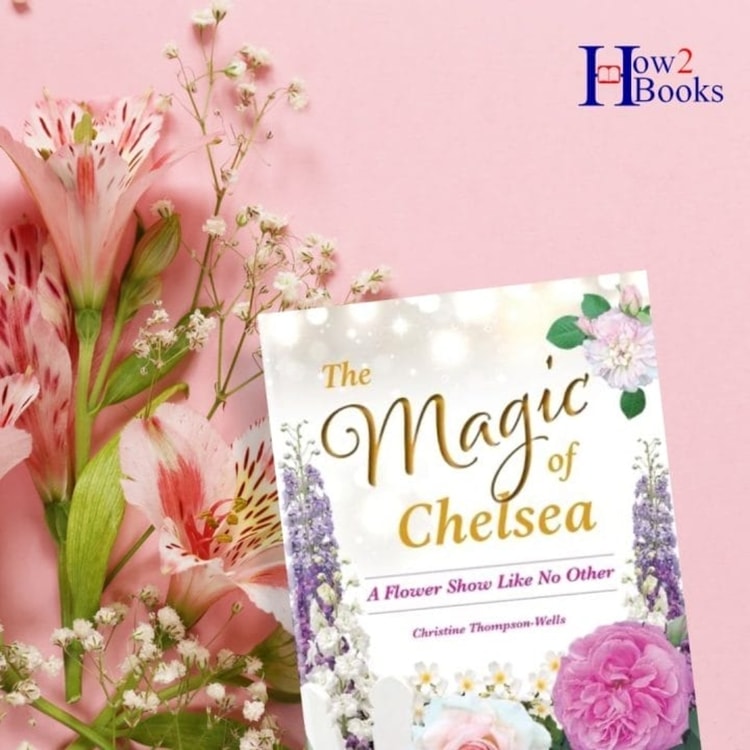 A book sitting on top of a table next to flowers