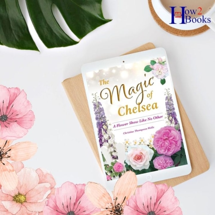 The magic of chelsea book next to pink flowers