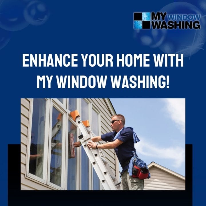 A man on a ladder painting a window