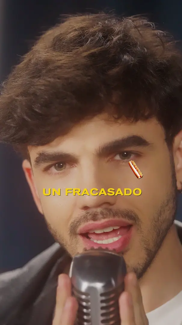 A man holding a microphone in front of his face