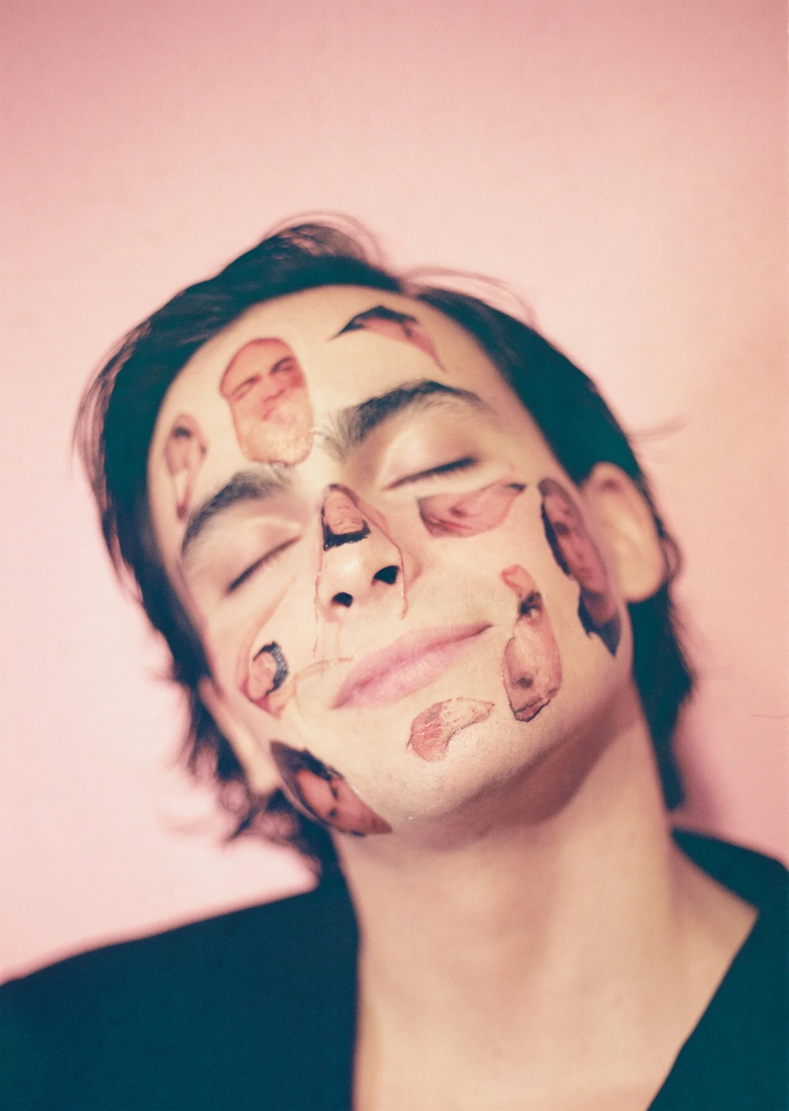 A man with his face painted with different faces