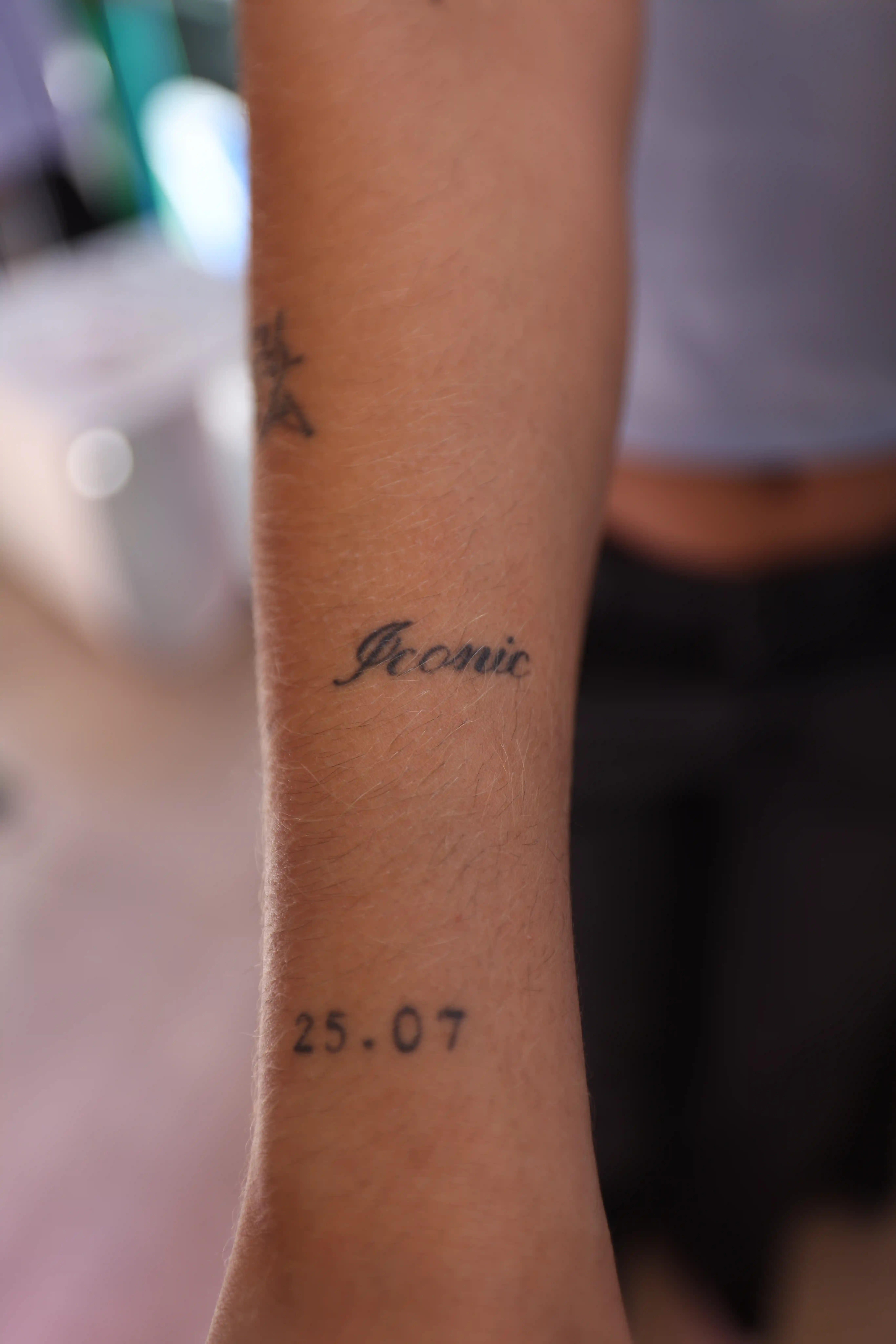 A close up of a person's arm with a tattoo on it