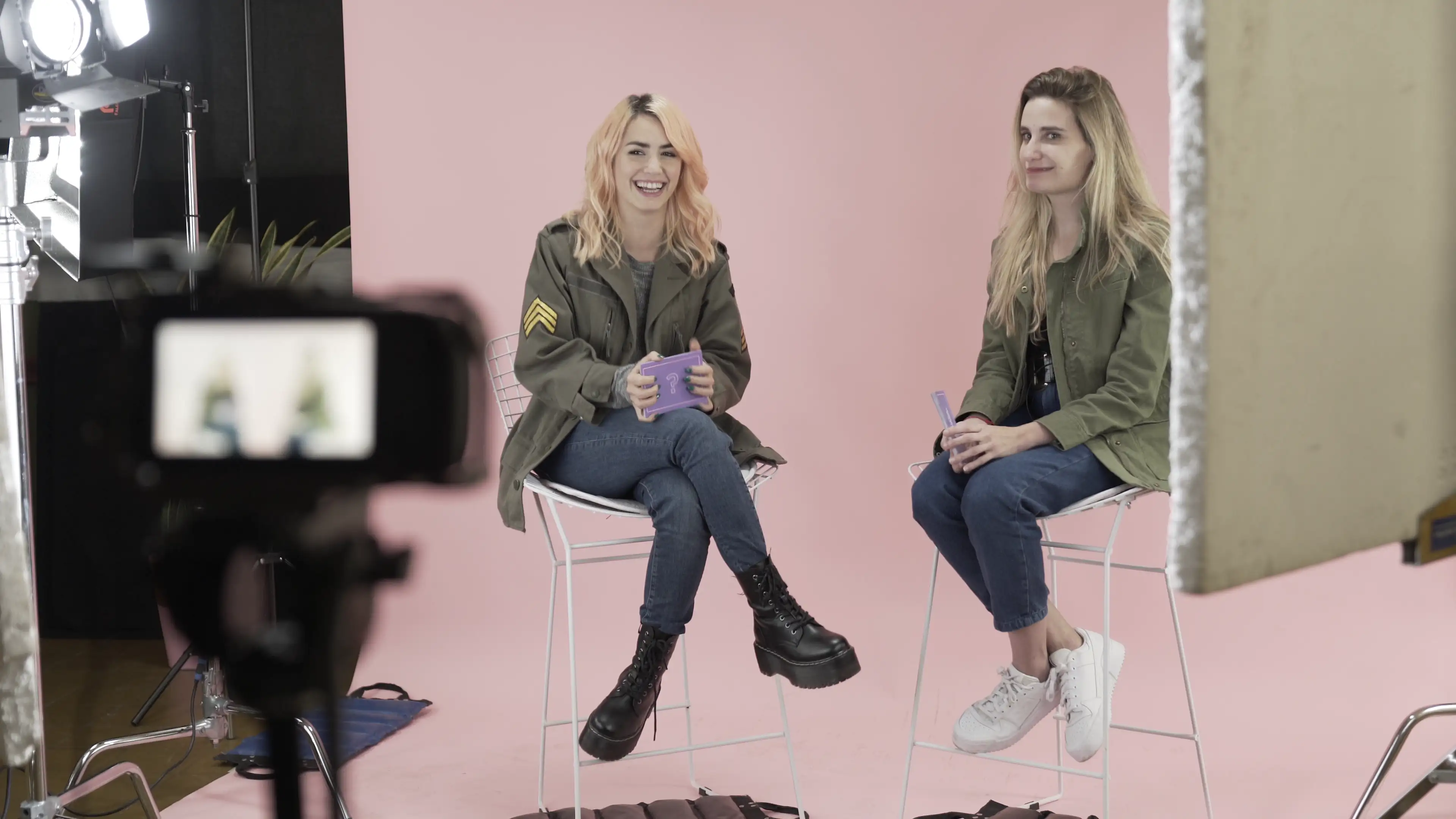 A couple of women sitting next to each other