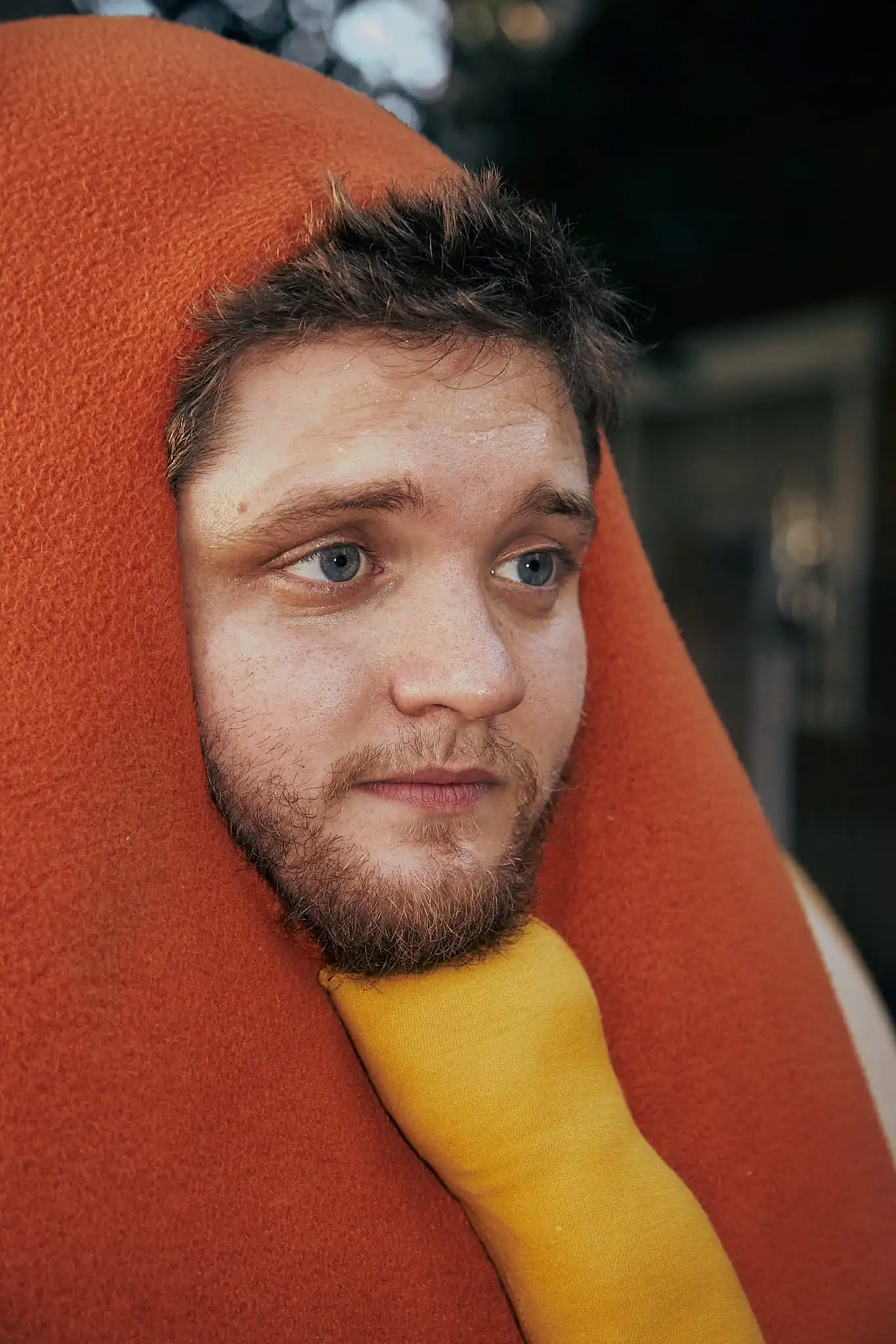 A man with a beard and a yellow tie