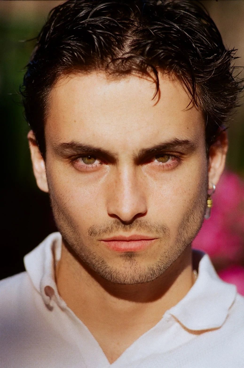 A close up of a person wearing a white shirt