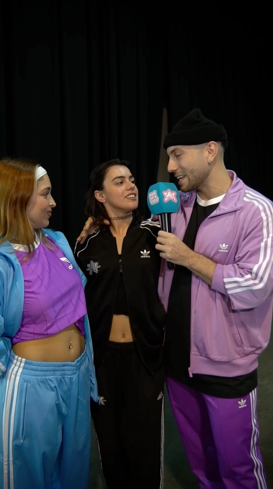 A man and two women talking to each other