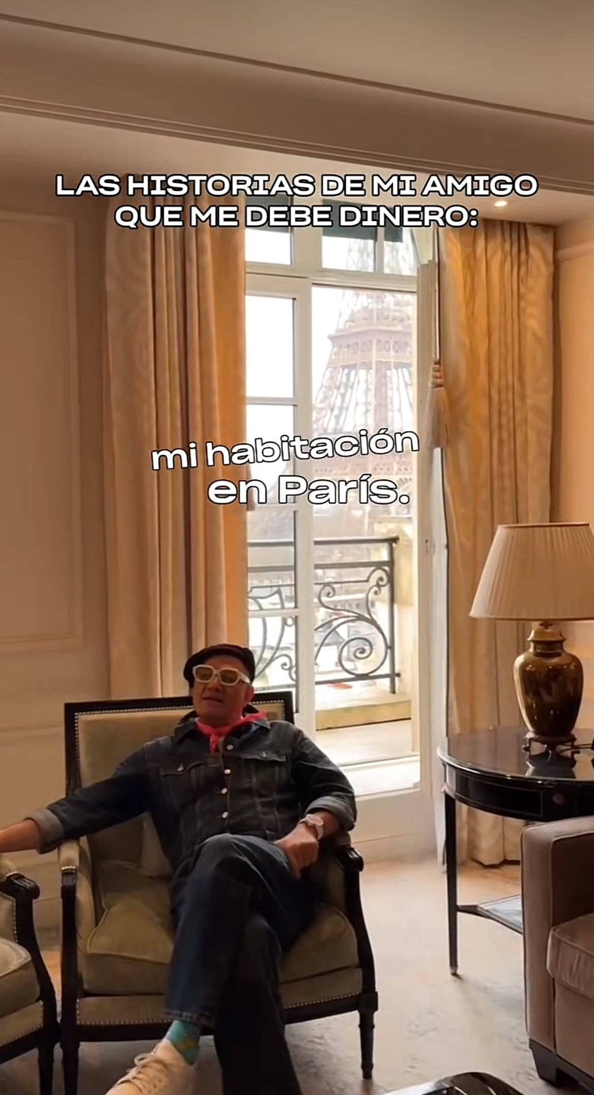 A man sitting in a chair in a living room