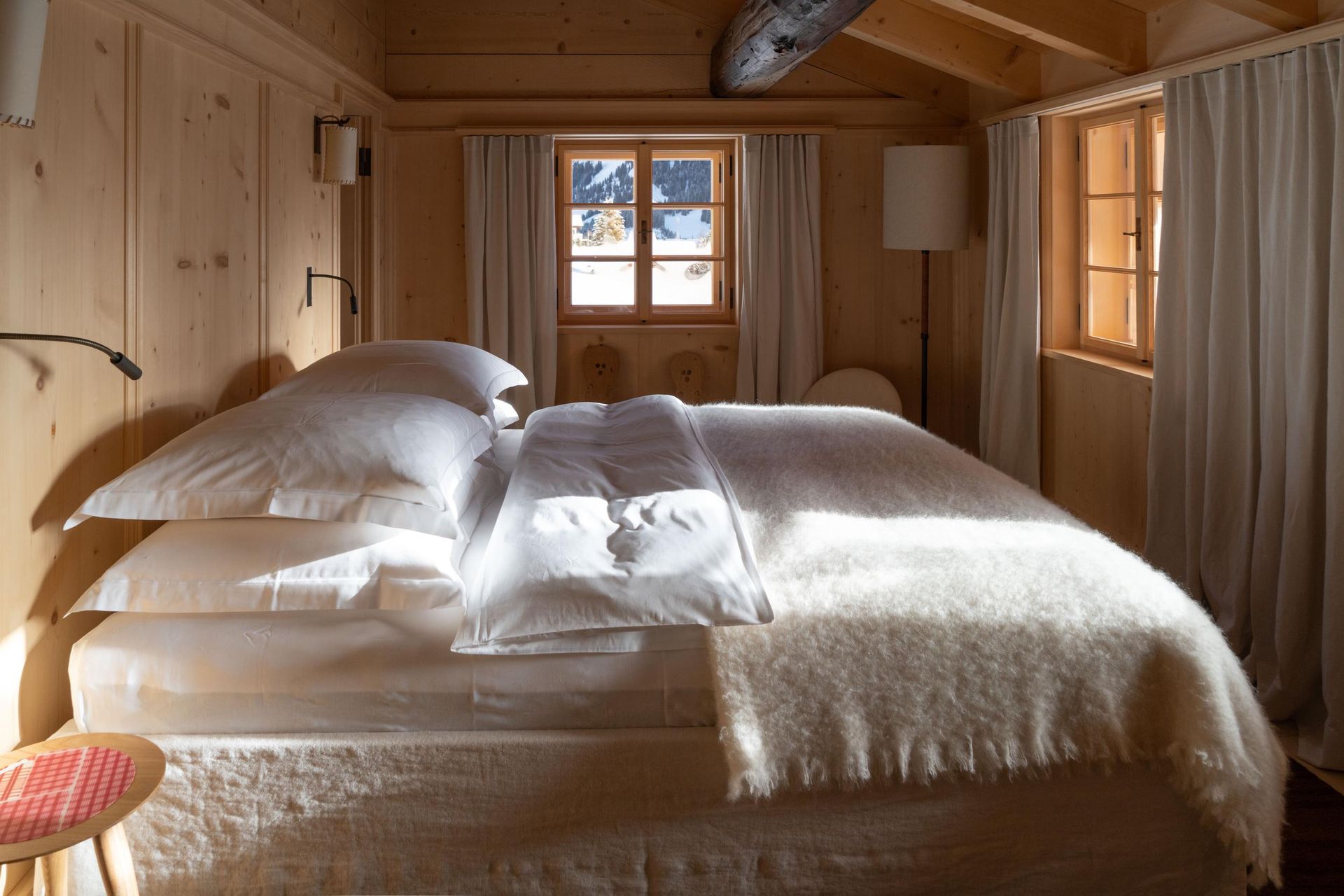 Sonnenhof_Full bedroom with blanket and windows