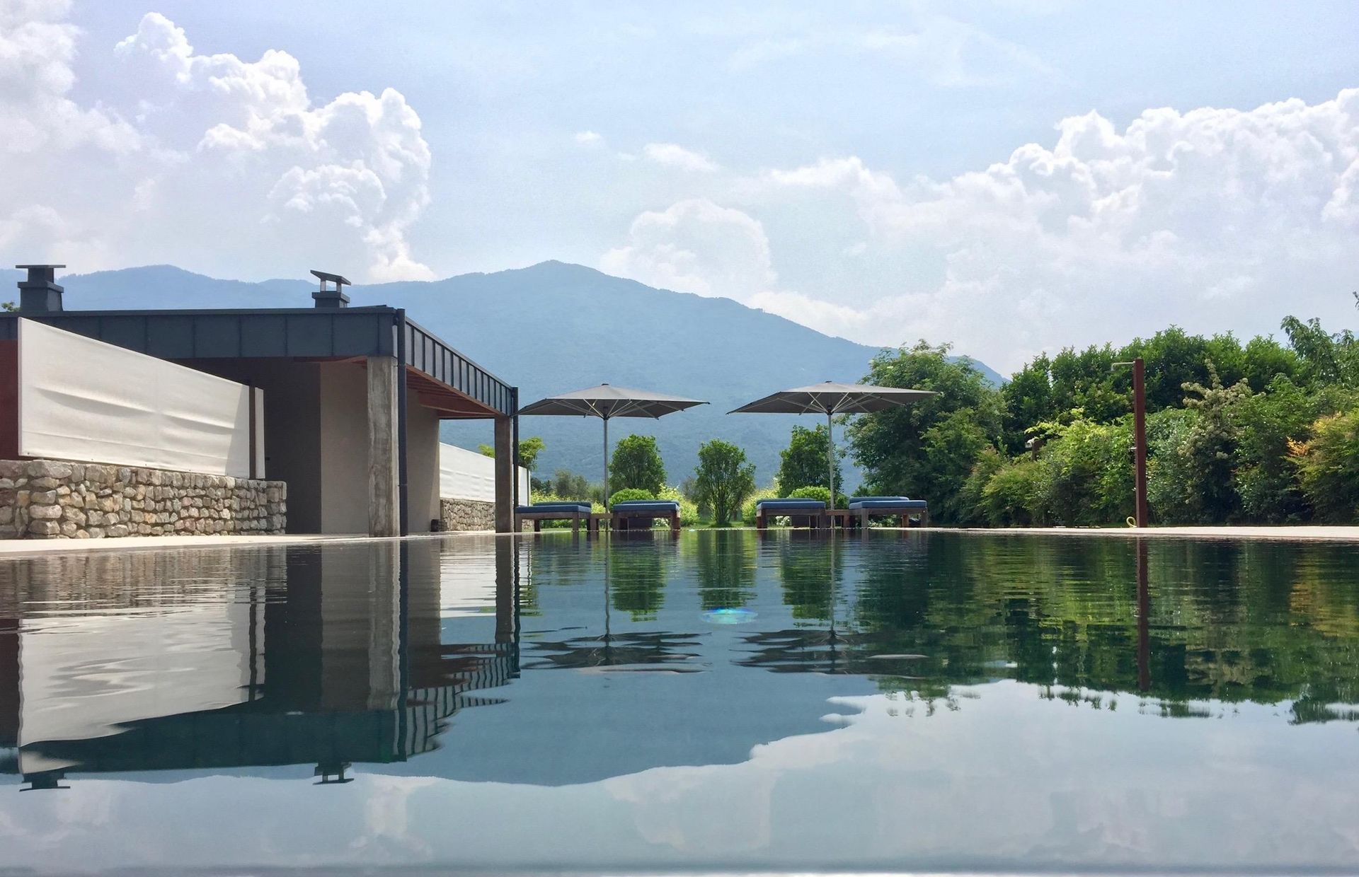 VIVERE Arco Italy_Horizontal Pool with Umbrellas