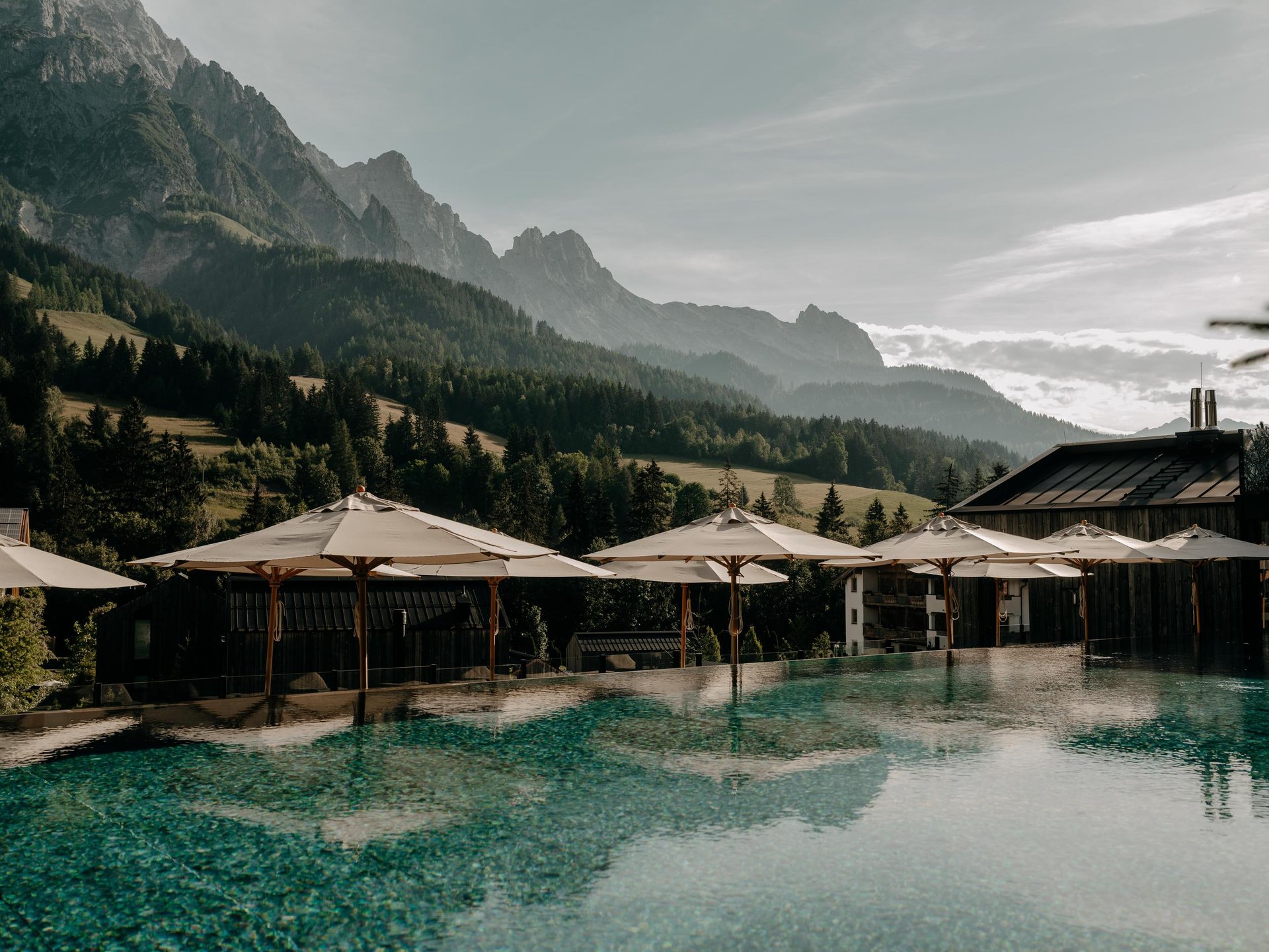 Forsthofgut Natur Hotel Pool with umbrellas horizontal