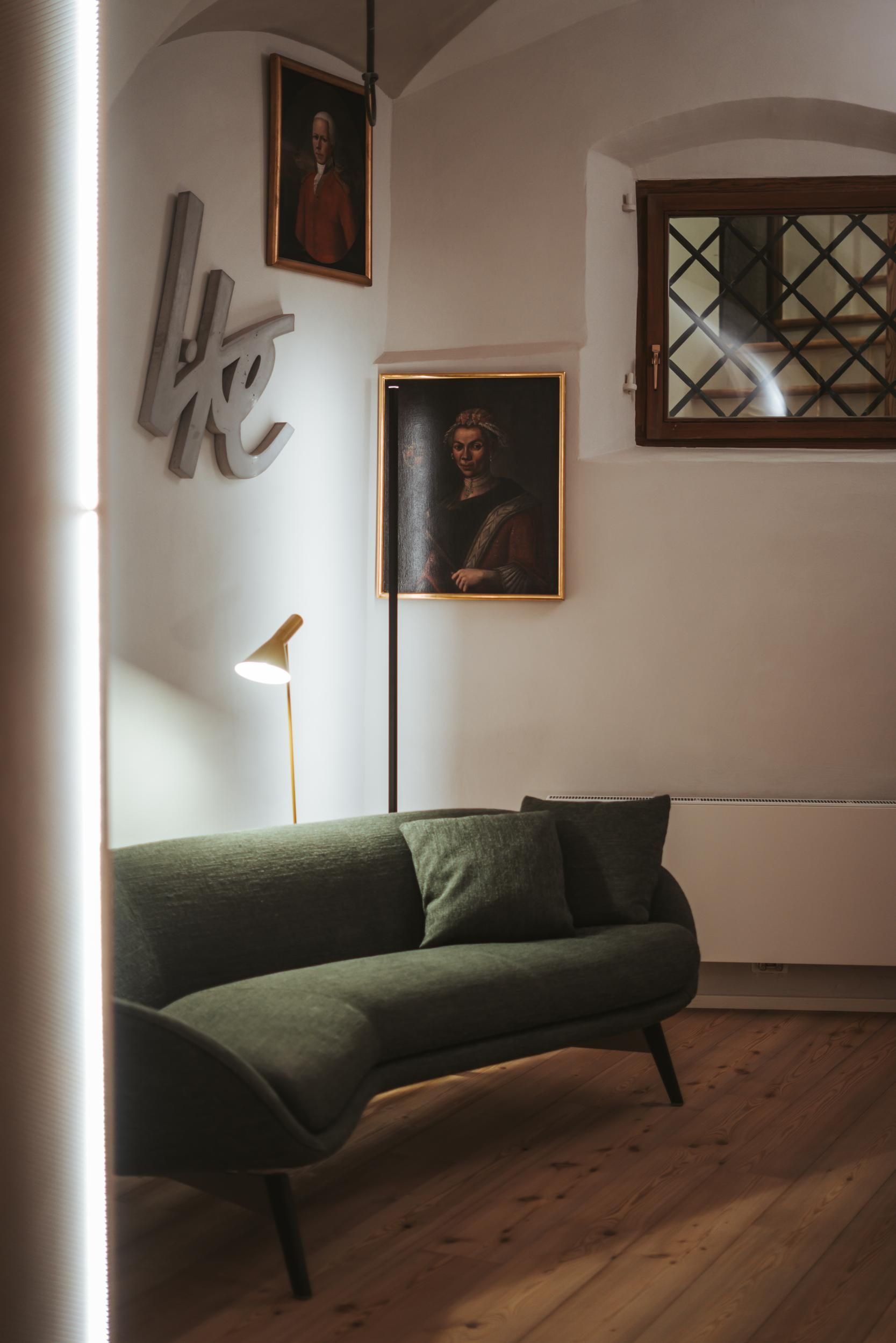 Arthotel Lasserhaus_sofa with art in background