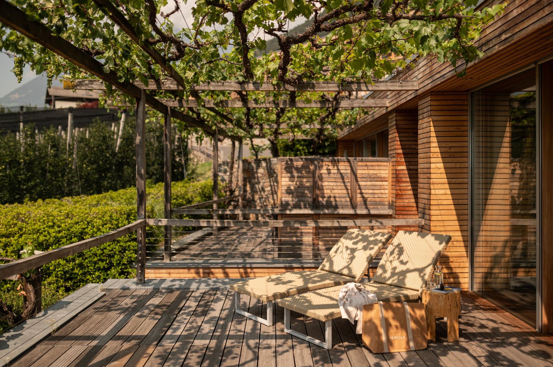 Pergola Residence_Suite Deluxe_Deluxe D_Patrick Schwienbacher_Terrace with Sunbeds