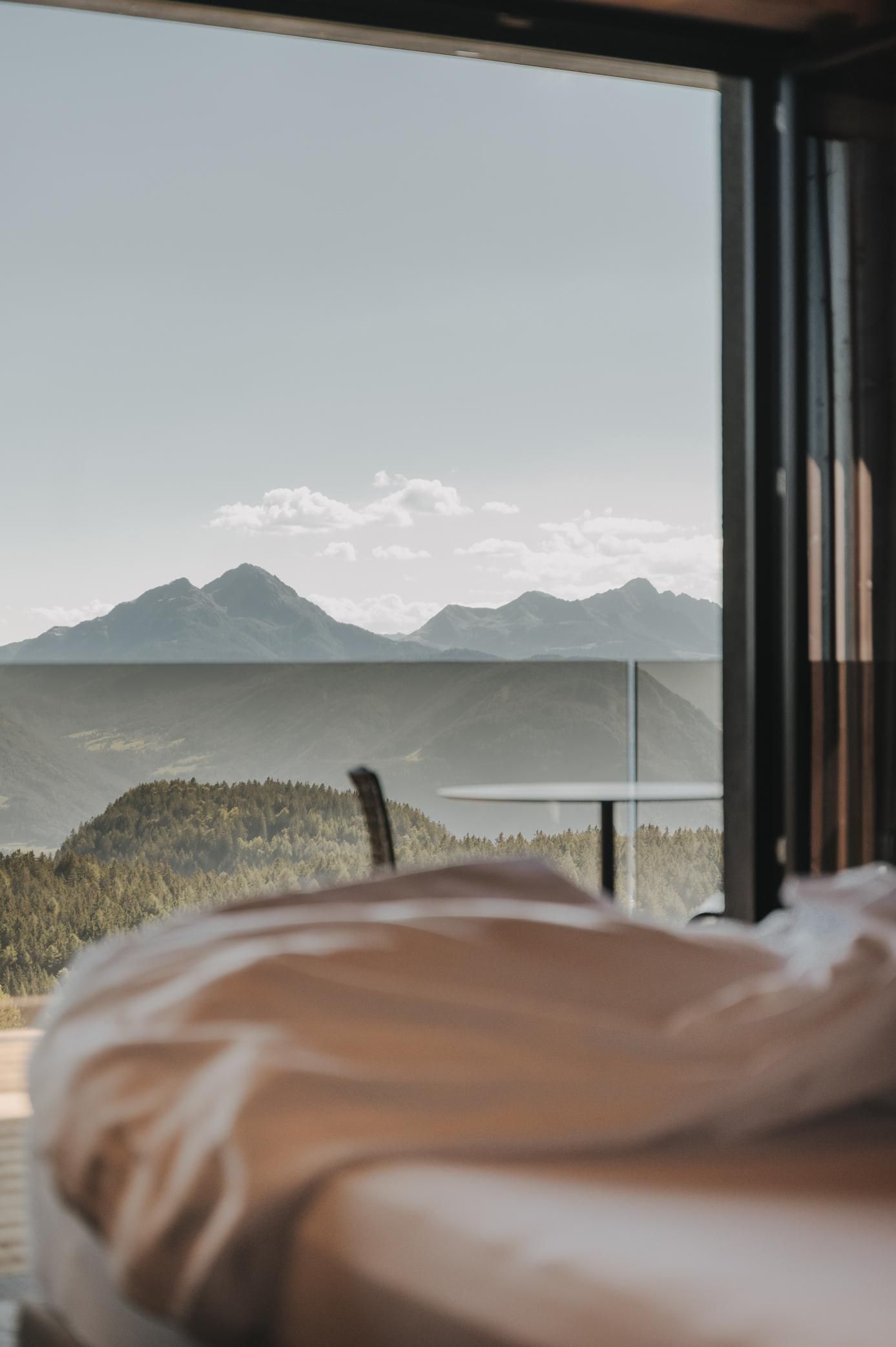 Chalet Mirabell_suite with bed and views. details