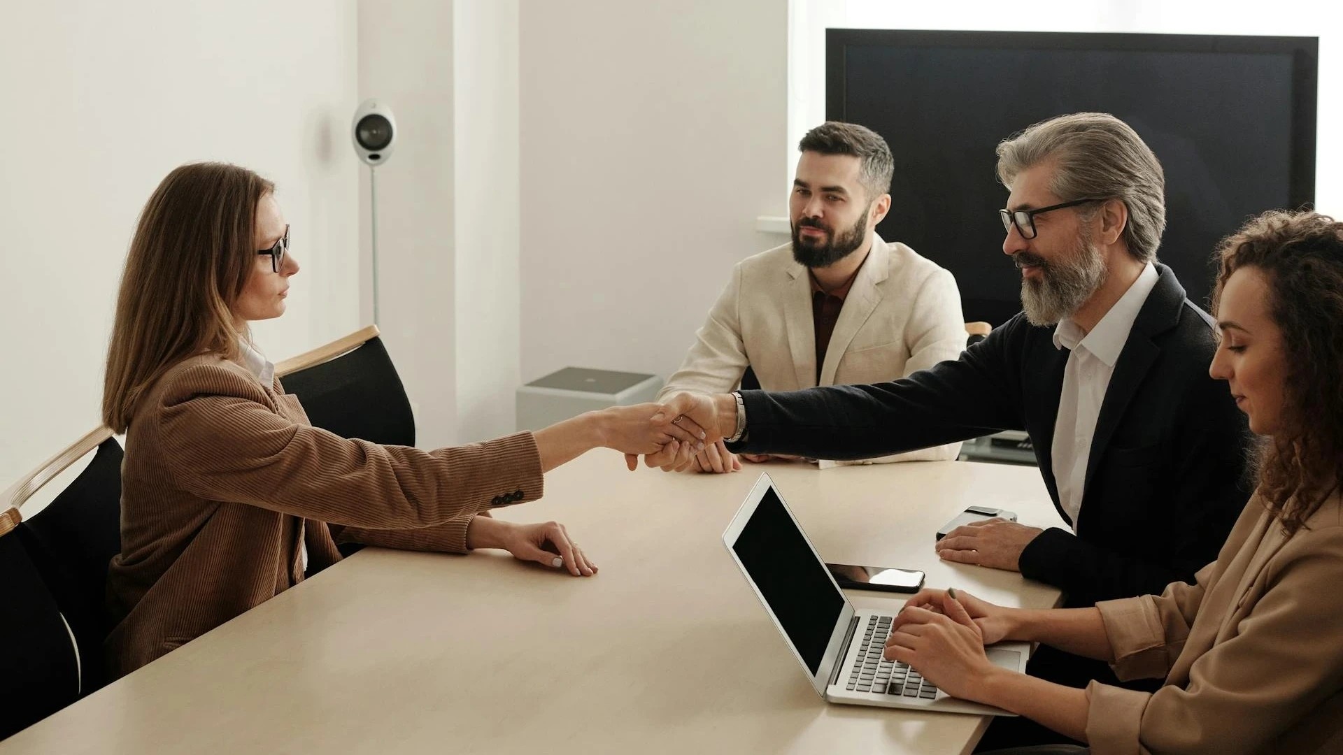 Business people sitting across a table