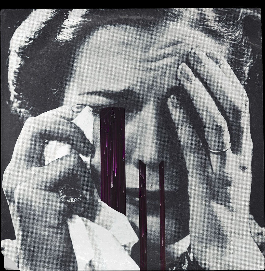 A black and white photo of a woman holding her hands to her face